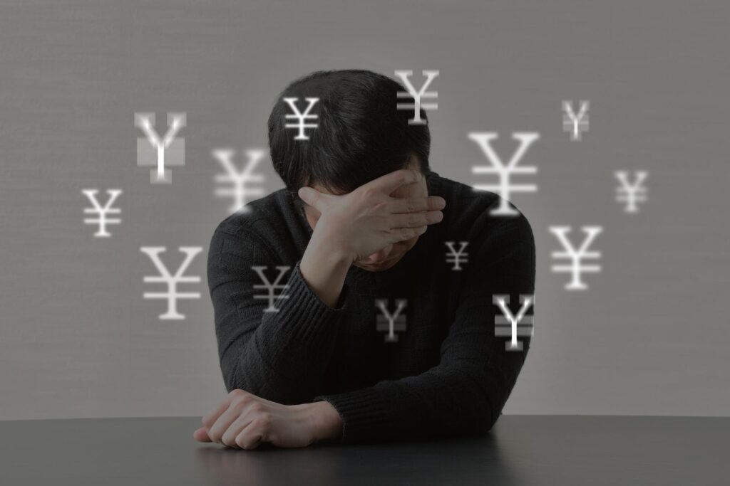 お金の悩みを抱える男性イメージ